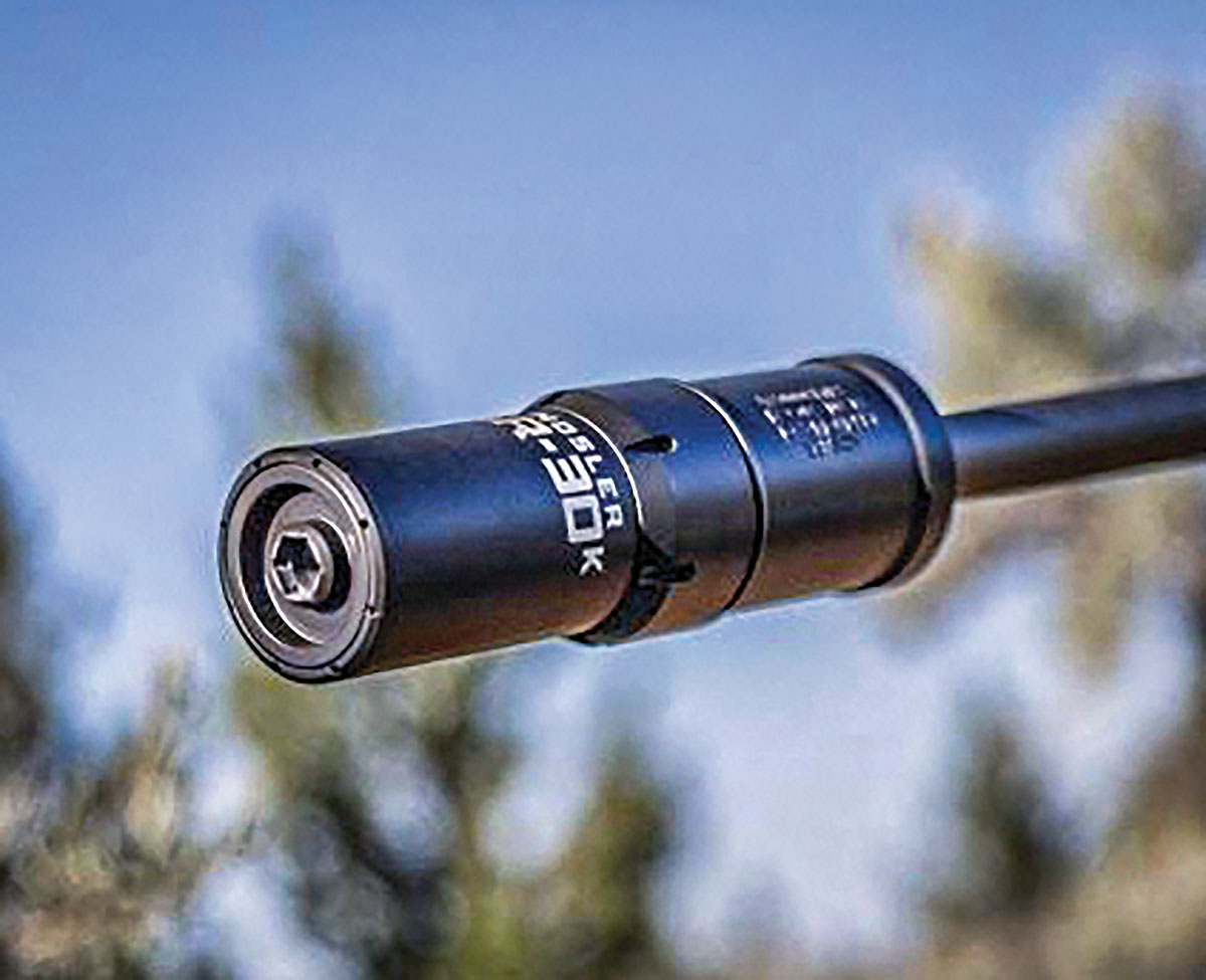 Attaching a suppressor to a rifle increases its weight by how much depending on which model is used. This Nosler SR-30K weighs 7 ounces, about as much as eight 308 Winchester cartridges.